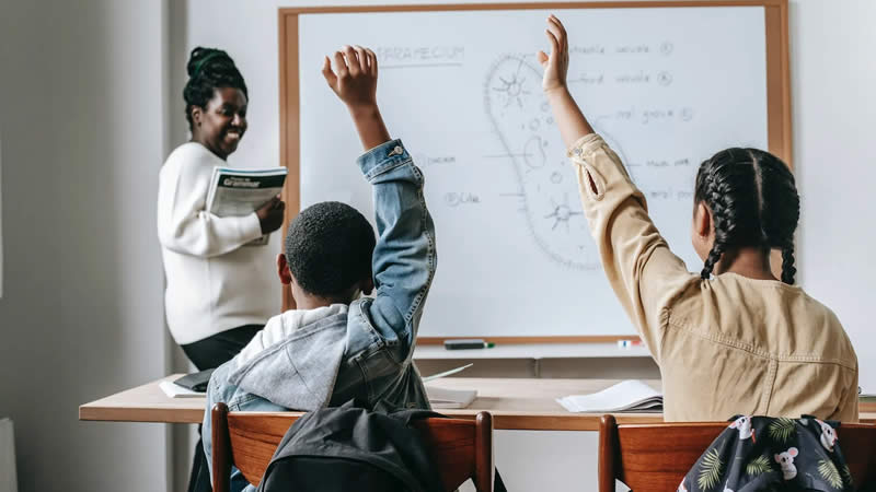 student raising hand